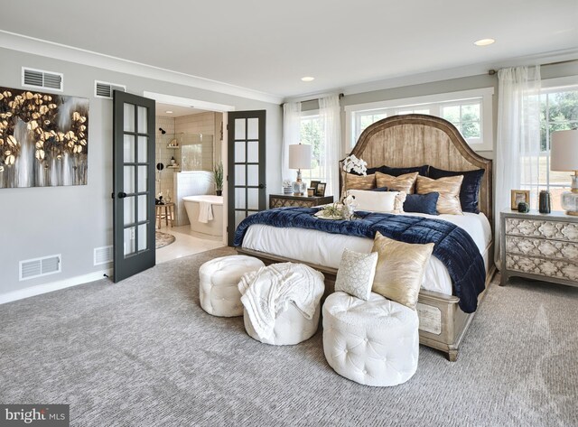 carpeted bedroom featuring connected bathroom, ornamental molding, multiple windows, and french doors