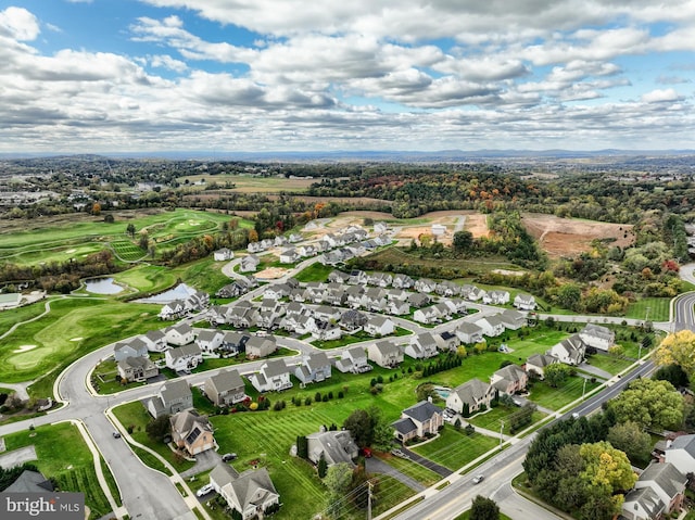 drone / aerial view featuring a water view and a residential view