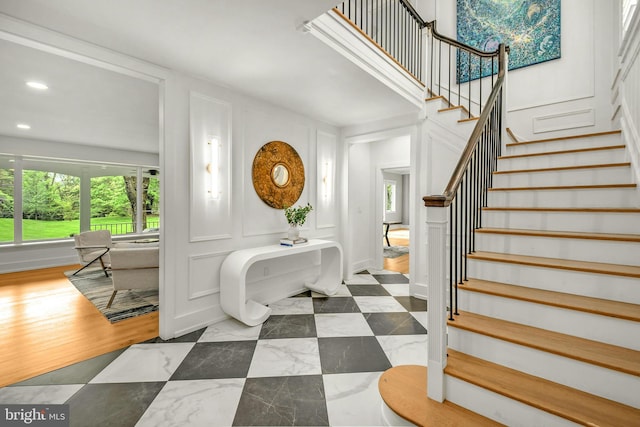 tiled foyer with a wealth of natural light