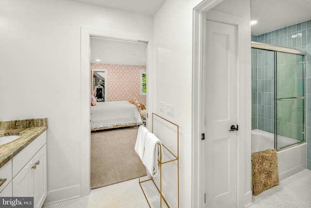 bathroom featuring tile flooring, shower / bath combination with glass door, and vanity