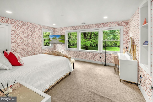 bedroom featuring carpet and multiple windows