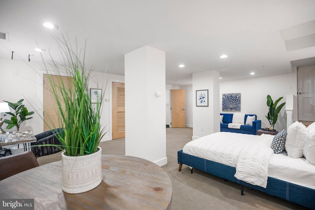 bedroom with light colored carpet