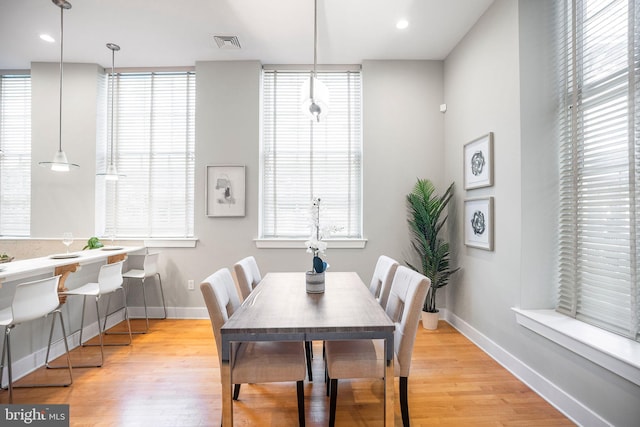 dining area featuring light wood-type flooring