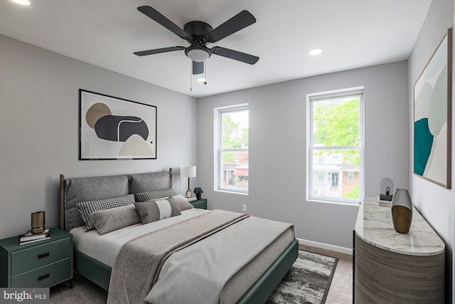 carpeted bedroom featuring ceiling fan