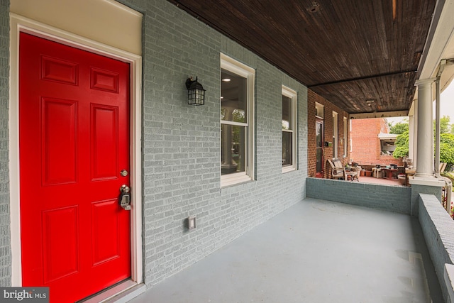 doorway to property featuring a porch