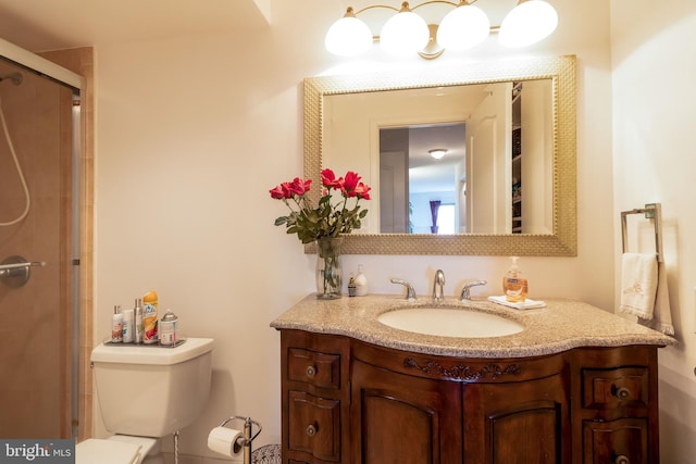 bathroom with toilet and large vanity