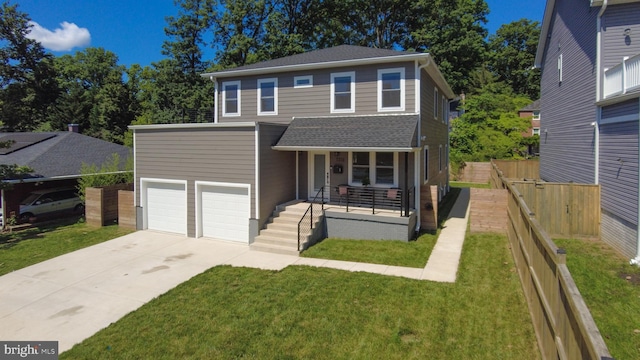 view of front of house featuring a garage, covered porch, and a front yard