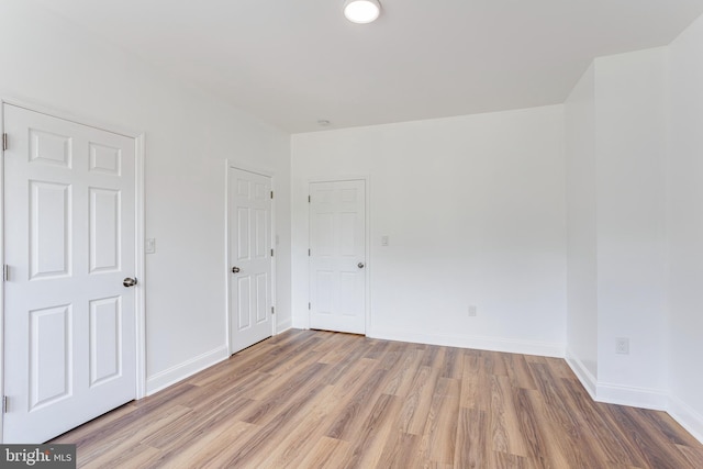 empty room featuring hardwood / wood-style flooring