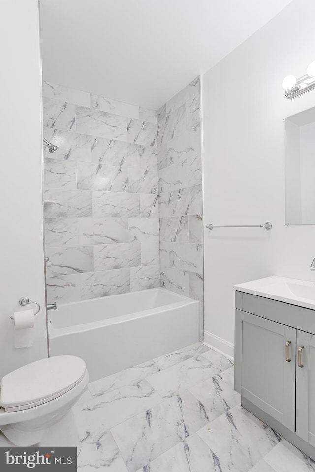 full bathroom featuring vanity, bathtub / shower combination, and toilet