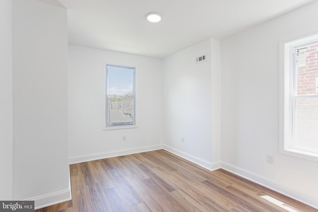 unfurnished room featuring light wood-type flooring