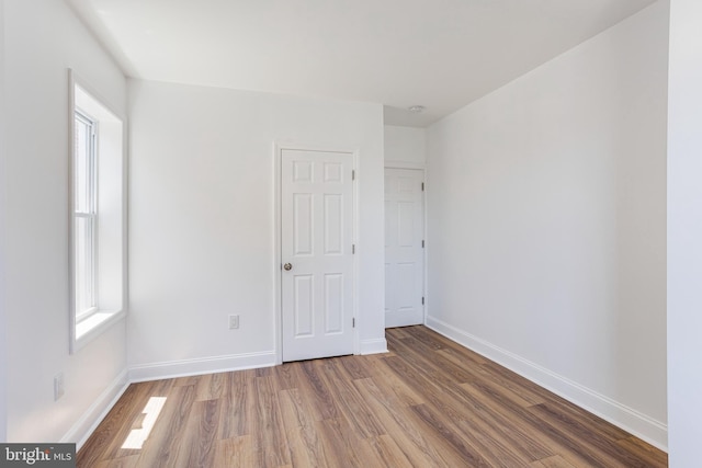 empty room with wood-type flooring