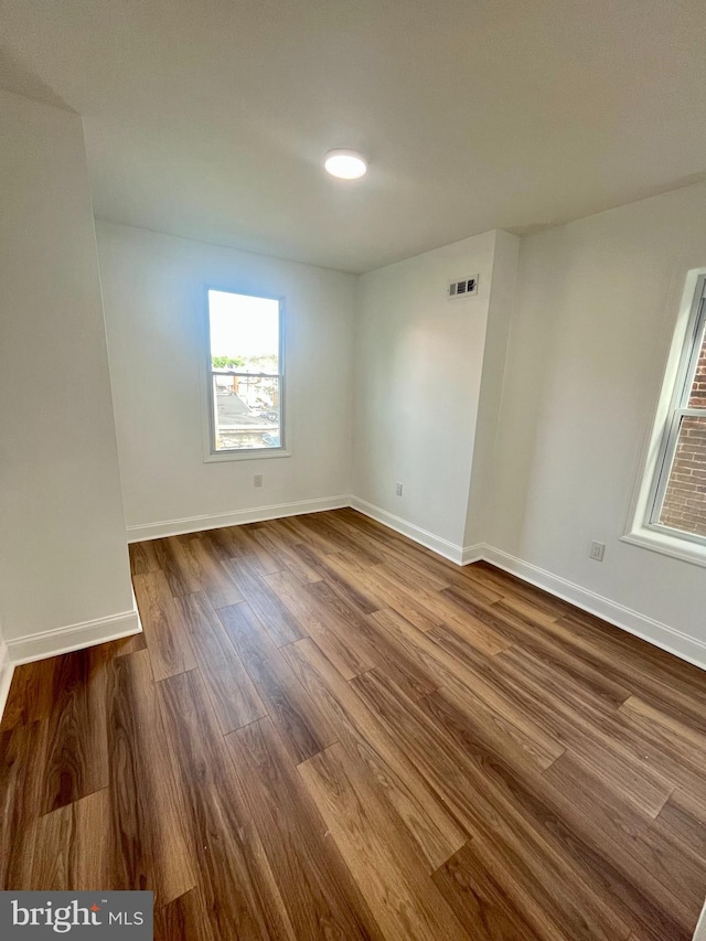 empty room featuring hardwood / wood-style flooring