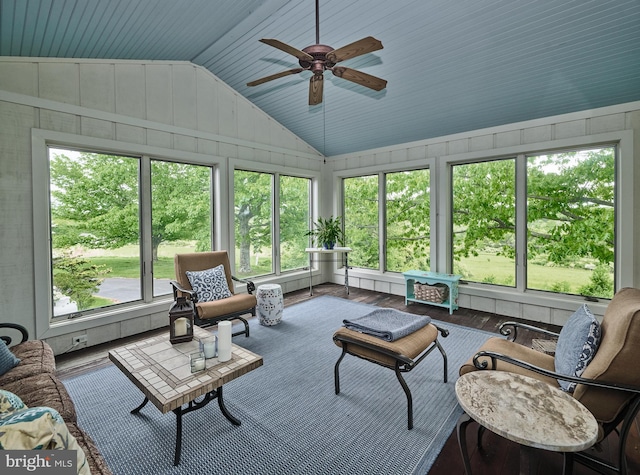 sunroom featuring a wealth of natural light, ceiling fan, and vaulted ceiling