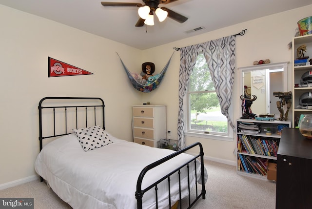 carpeted bedroom featuring ceiling fan