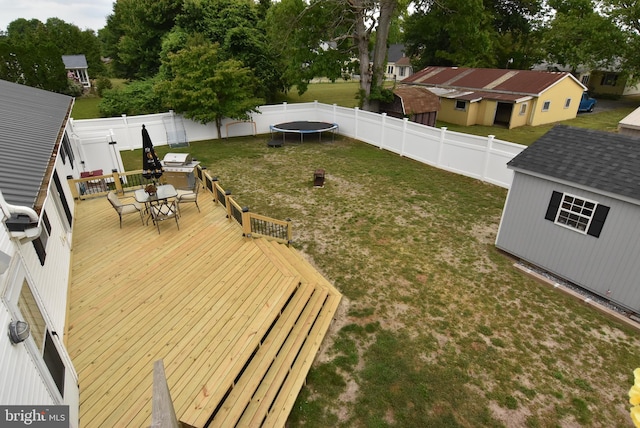 wooden terrace featuring a trampoline