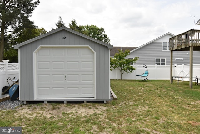 garage featuring a lawn