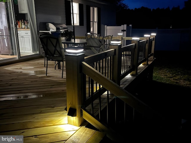 deck at night with grilling area