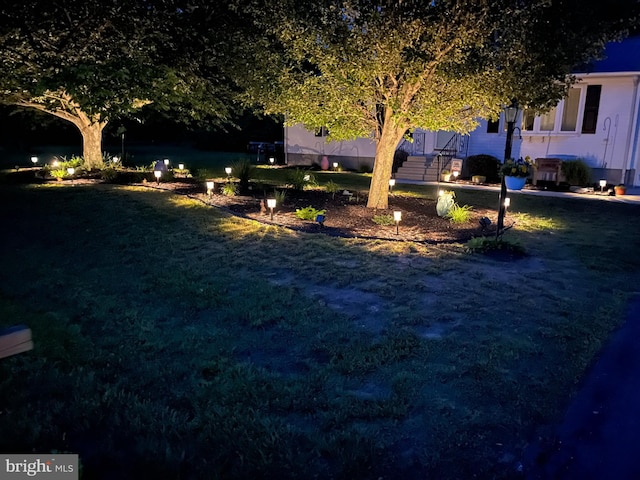 view of yard at twilight