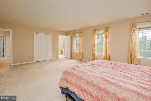 carpeted bedroom with a closet