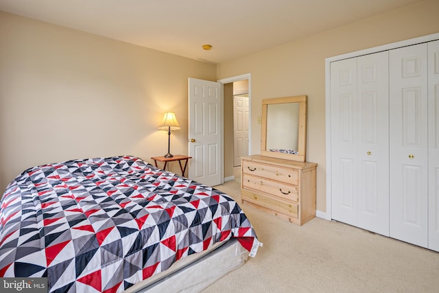 bedroom featuring a closet and carpet floors