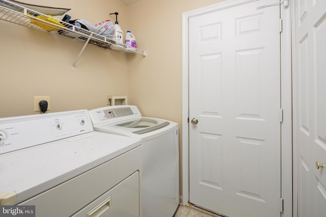 laundry area with independent washer and dryer, hookup for an electric dryer, and hookup for a washing machine