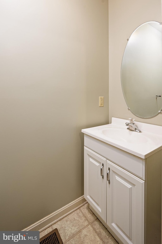 bathroom with tile floors and vanity with extensive cabinet space