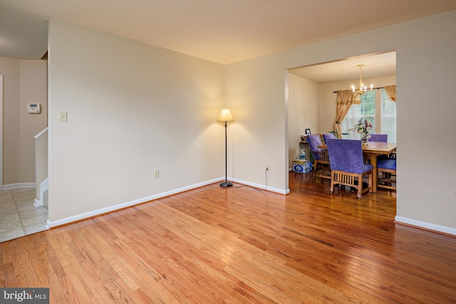 interior space with hardwood / wood-style floors and a chandelier