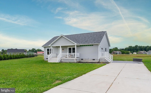 view of front of home featuring a front yard and covered porch