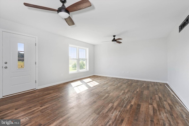 interior space featuring ceiling fan and dark hardwood / wood-style flooring