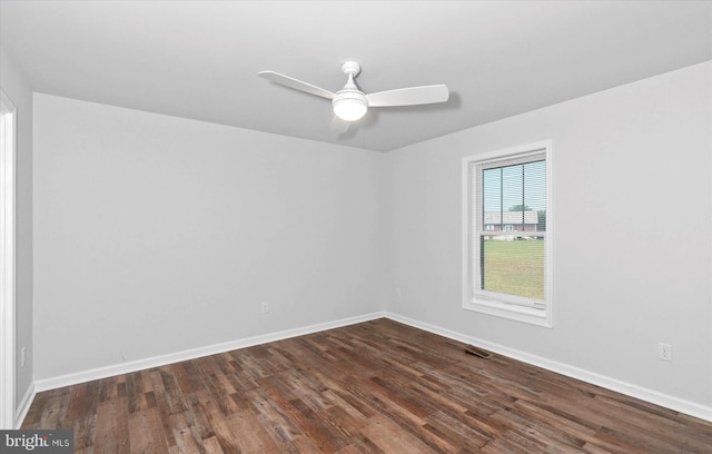 empty room featuring ceiling fan and dark hardwood / wood-style floors