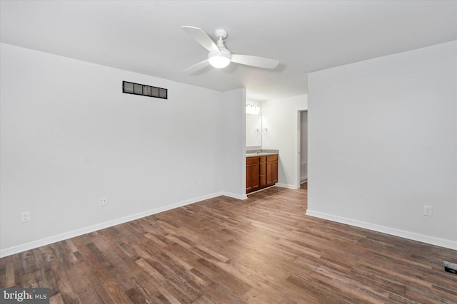 spare room featuring hardwood / wood-style flooring and ceiling fan