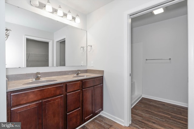 bathroom featuring vanity and wood-type flooring