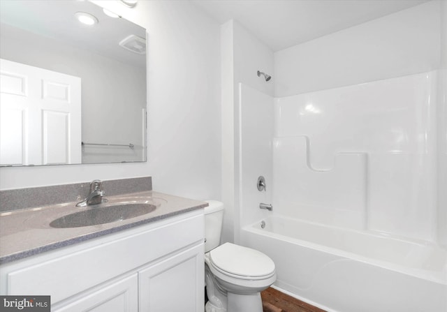 full bathroom featuring toilet, vanity, shower / bath combination, and hardwood / wood-style flooring