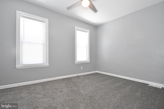 empty room with carpet and ceiling fan