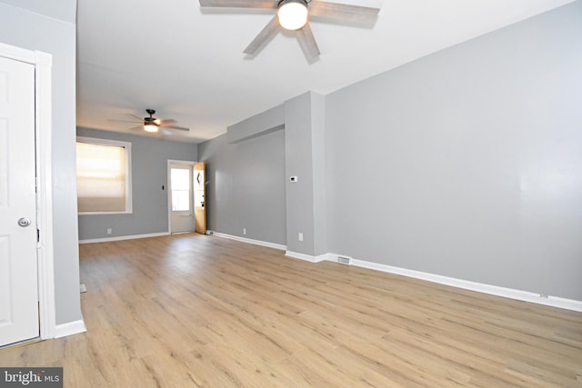 spare room featuring ceiling fan and light hardwood / wood-style floors