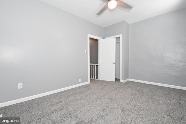 unfurnished room featuring carpet floors and ceiling fan