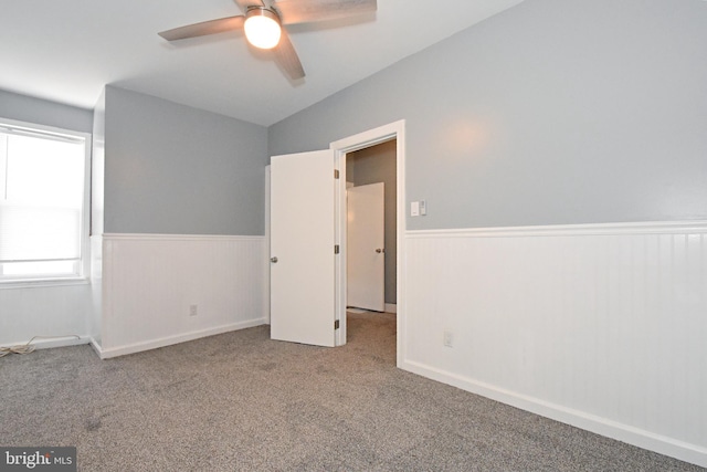 unfurnished bedroom with carpet floors and ceiling fan