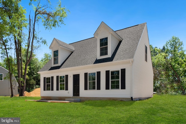 new england style home with a front yard