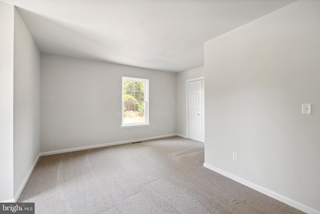 spare room with carpet floors