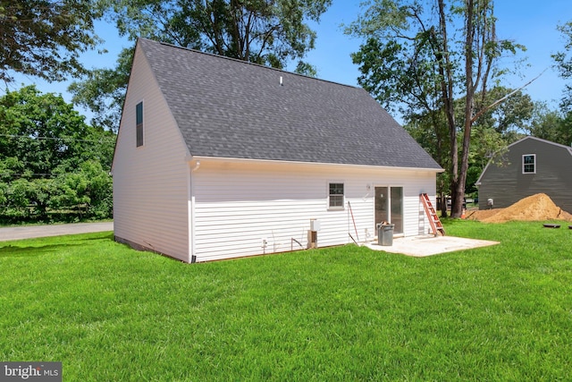 back of house with a yard