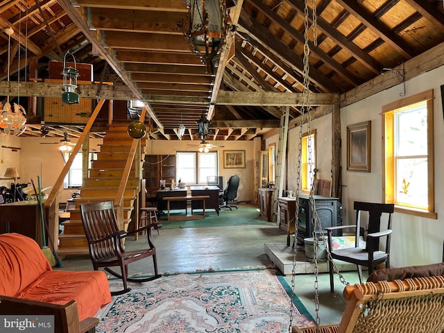 interior space with high vaulted ceiling, concrete flooring, and plenty of natural light