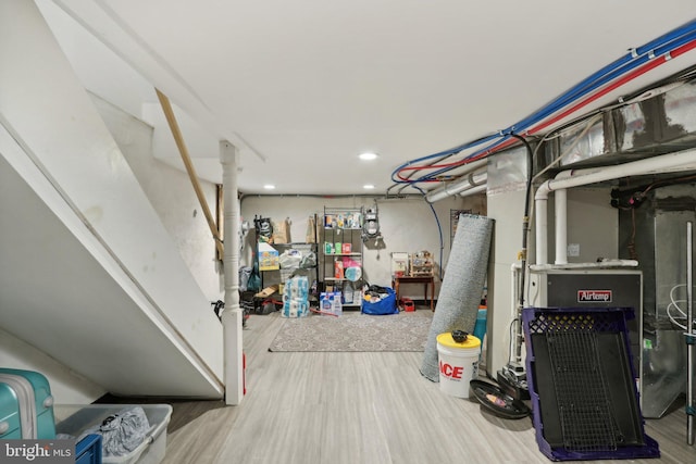 basement featuring hardwood / wood-style flooring