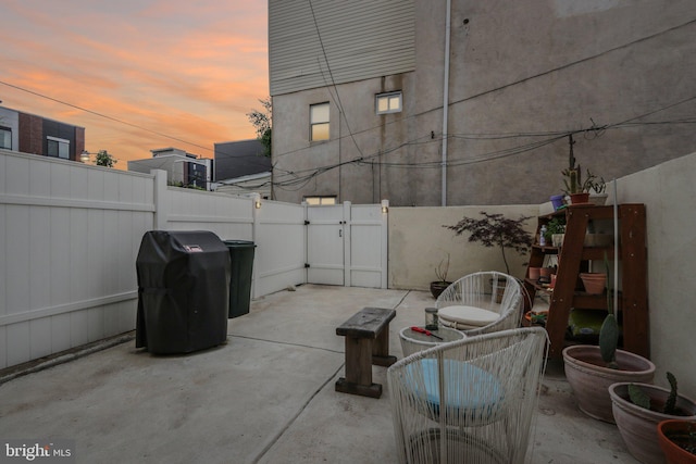 view of patio terrace at dusk