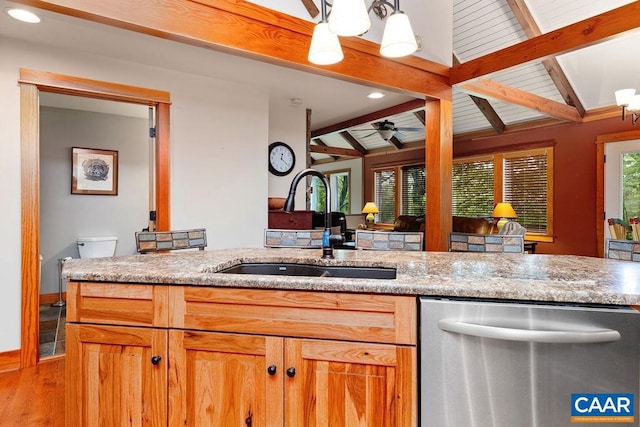 kitchen featuring decorative light fixtures, light hardwood / wood-style floors, ceiling fan, vaulted ceiling with beams, and stainless steel dishwasher