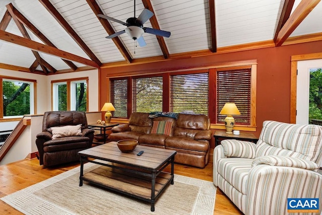 living room with high vaulted ceiling, beamed ceiling, ceiling fan, and light hardwood / wood-style floors