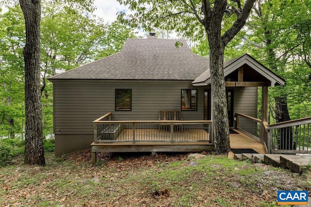 back of property with a wooden deck