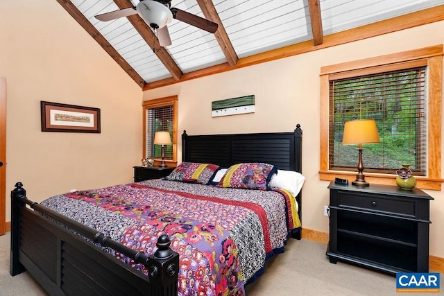 carpeted bedroom with vaulted ceiling with beams and ceiling fan