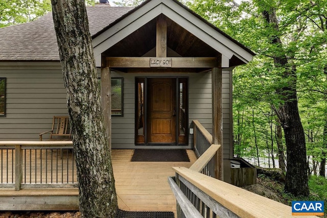 doorway to property featuring a wooden deck