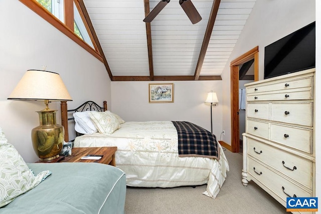 carpeted bedroom featuring ceiling fan and vaulted ceiling with beams