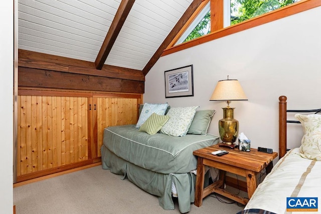 bedroom featuring beamed ceiling, high vaulted ceiling, and carpet floors